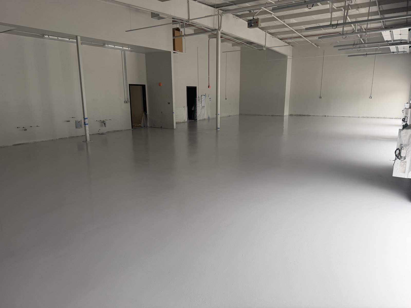 Commercial warehouse with light gray epoxy floor