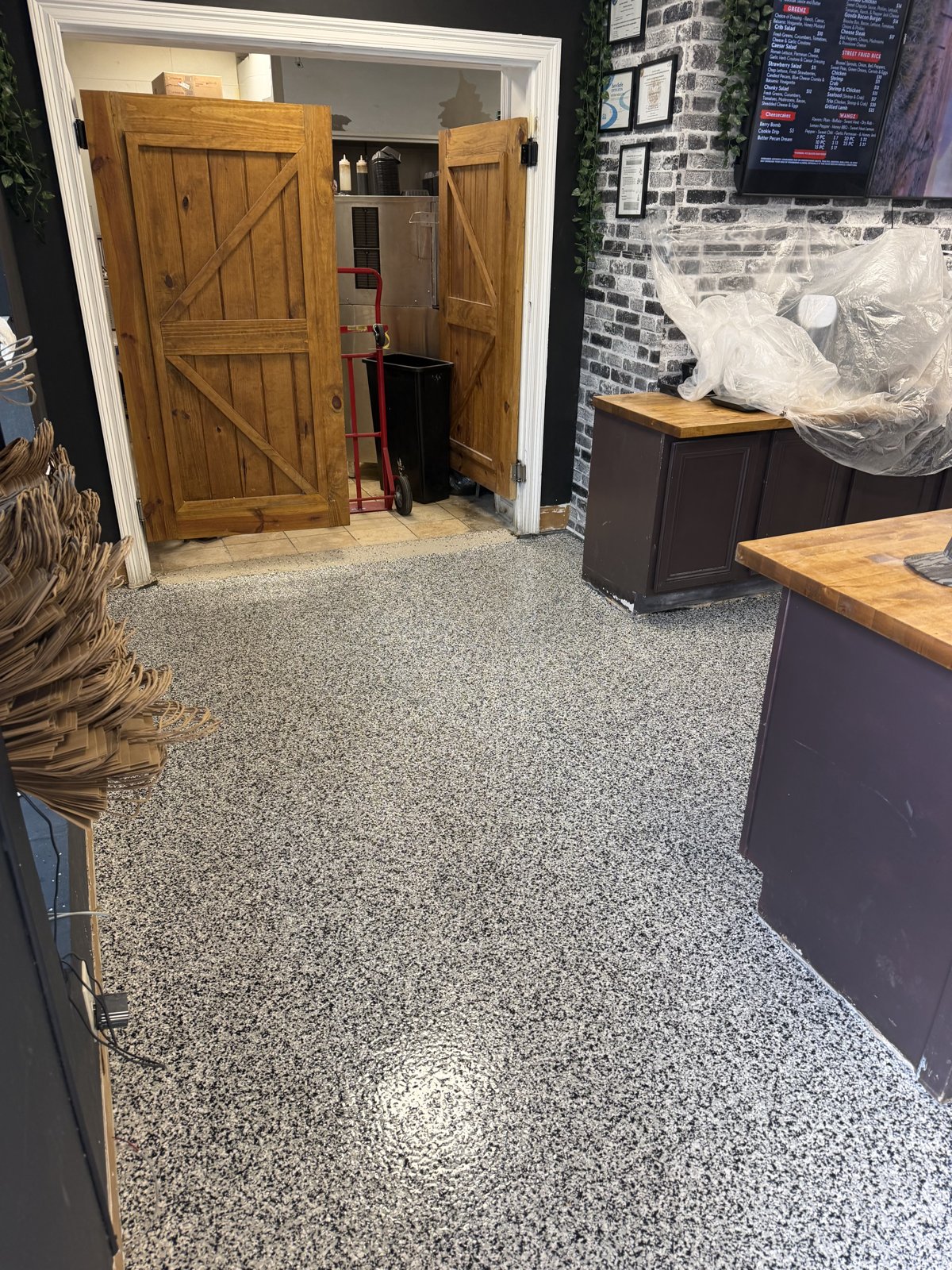 Decorative flake floor in food service prep area, similar to school cafeteria flooring