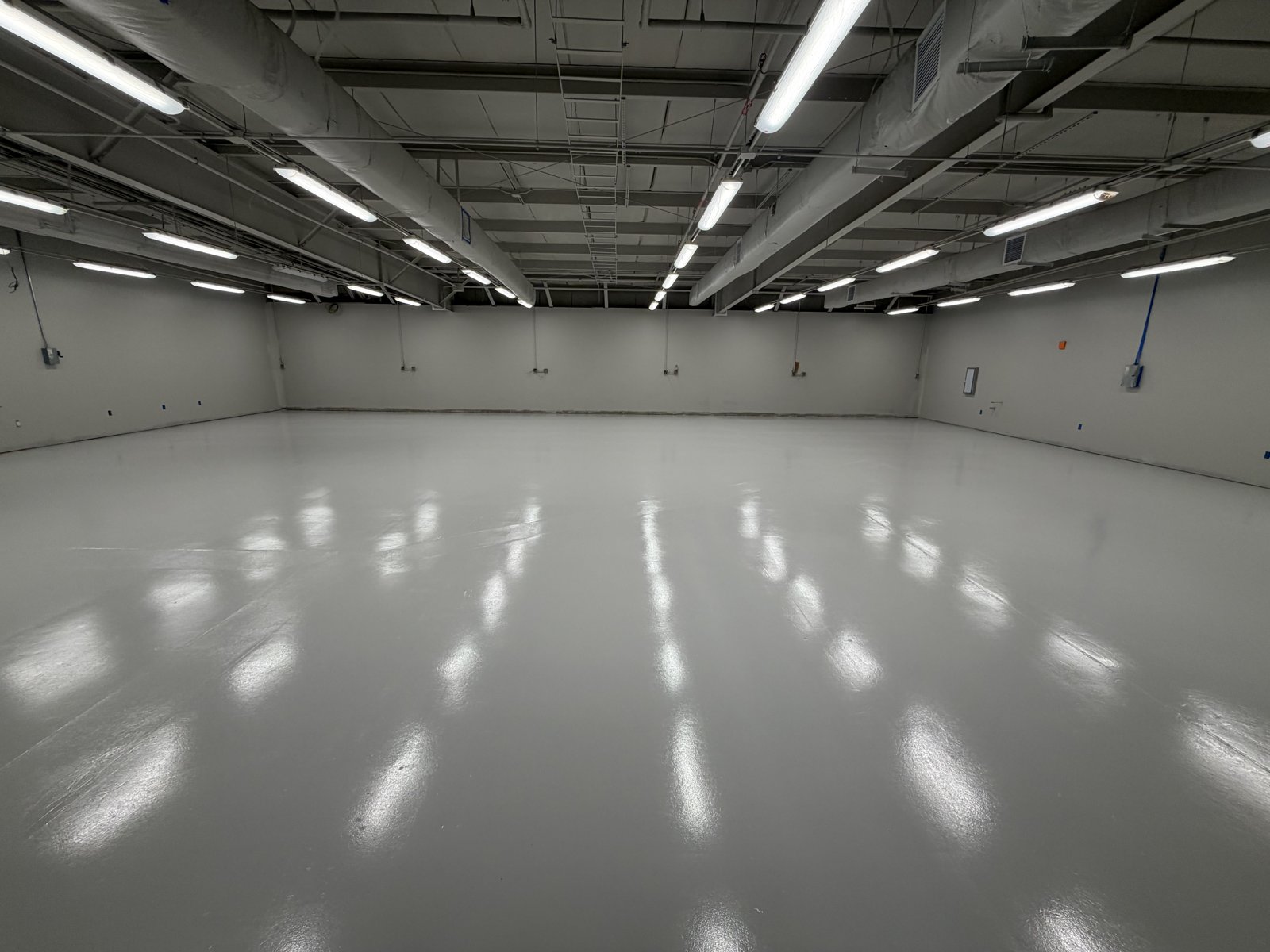 Large industrial warehouse with high-gloss gray epoxy