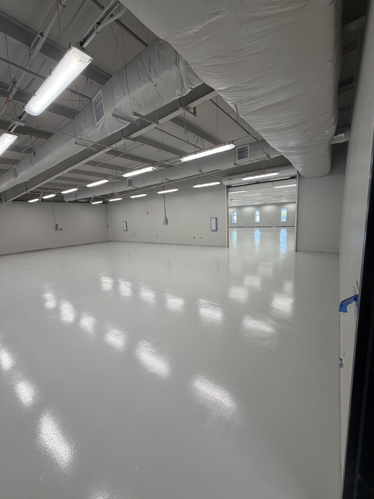 High-gloss white epoxy warehouse floor